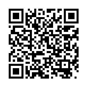 一个个高大整齐的书柜矗立在里面二维码生成