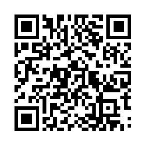 一只有着黄黑斑点的猎豹正趴伏在草原上二维码生成