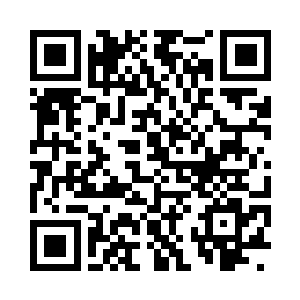 一点点的光芒在巫毒娃娃漆黑的眼睛当中闪过二维码生成