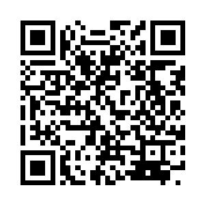 一辆形如战车的车子在街道上缓缓驶来二维码生成