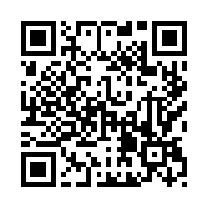 一辆黑色的商务车停在电视台门口二维码生成