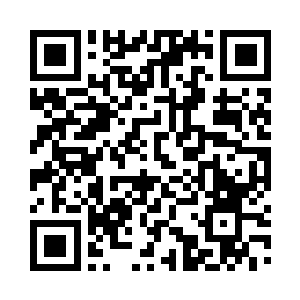 一边从一摞书中取出一个大红封皮的毕业证二维码生成