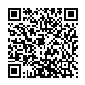 丁长生向身边一个已经将孩子送进商务楼的老太太问道二维码生成