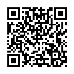 书桌上摆着已经整理完的九本账本了二维码生成
