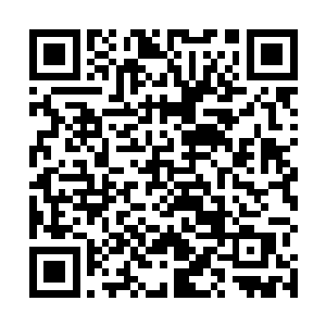 使得吴虎臣整个人看上去就如同一尊镀金了的大佛一般二维码生成