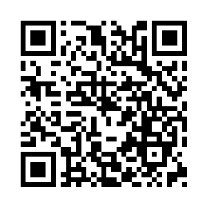 便清晰地看到一颗炸弹自一旁的楼房之上二维码生成