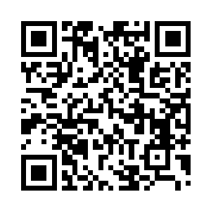 像是一个白色雕塑一般稳稳的坐在洞口旁二维码生成