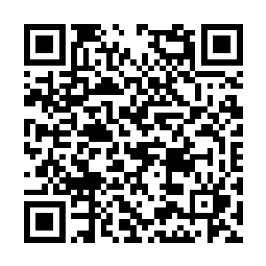 却看张飞身后霍地显现出一面骇人的黑色罗刹相势二维码生成