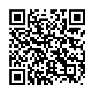 只见一根粗壮的石柱上绑着一个人二维码生成
