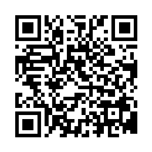 叶明静认真端详完全没展开的皱巴巴孝儿二维码生成