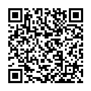 叼着香烟的巴克在听到老婆说已经抵达滩涂地区以后二维码生成