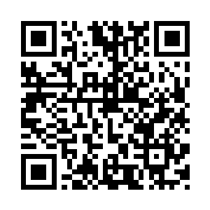 咕仔把那弹子交给坐在他身边的父亲二维码生成