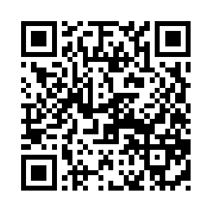 在他的那张四正四方不满威严的面孔上二维码生成