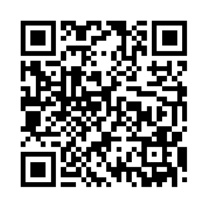 在另一张桌上的郑达民电话突然响了二维码生成