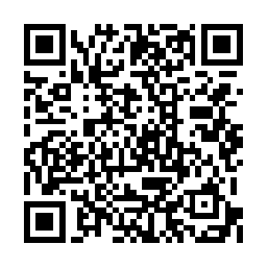 在数十个义和团拳民与甘军士兵躺倒在地上之后二维码生成