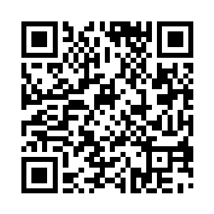 在紫宝石的中间藏着一块青色透明的水晶石头二维码生成