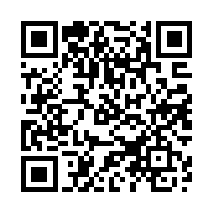 坐上出租车的沙摩塞听司机询问到二维码生成