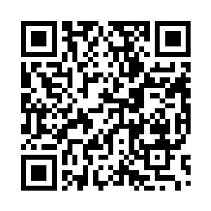 坐在主位翻看报纸的边学道合上报纸二维码生成