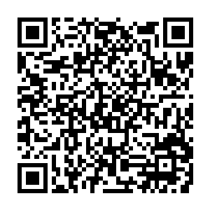 实在是王万余的这一身穿着跟周围皱巴巴的中东武装分子的穿着也差不多二维码生成