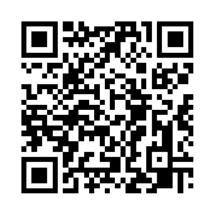 对站在固定电话旁犹豫什么的唐红霞说二维码生成