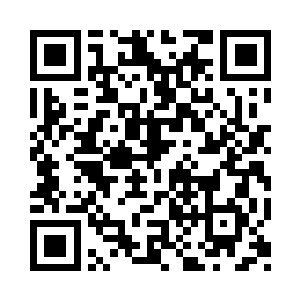 山洞里居然还放着一张行军床和一床被子二维码生成