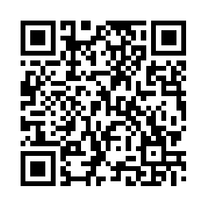 峒箫一动不动地站在巨大的头颅面前二维码生成