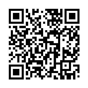 怀旧气息的皮椅和矮木桌错落地摆放二维码生成