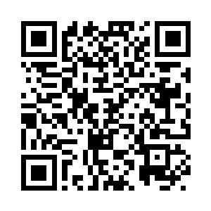 把手里喝净的茶杯放在面前的小几上二维码生成