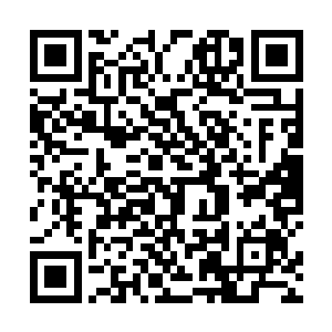 旋转重机枪上六联装枪管在马达的轰鸣中急速的转动着二维码生成