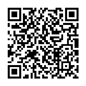 最后他找了一家在的黎波里盖大楼的华夏建筑公司二维码生成