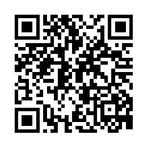 梁炎斜靠在沙发上晃动着酒杯里的酒液二维码生成