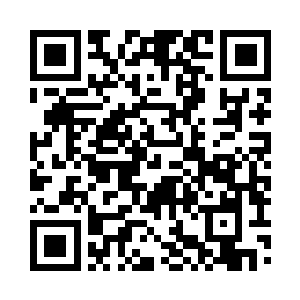 此时正在黑暗当中发出了淡淡光亮的卷轴二维码生成