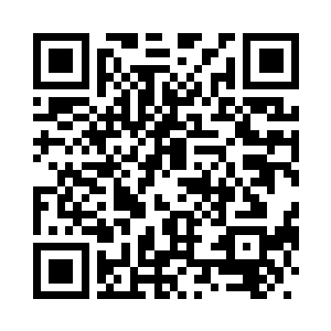 江帆和黄富顺着纳甲土尸的手指看二维码生成