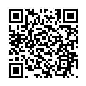 男人桌子上的一个对讲机里传来声音二维码生成