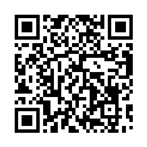 目光冰冷的望着审讯台后面的这个人二维码生成