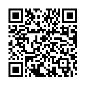 目光注视着荒草深处露出的那一小截石碑二维码生成