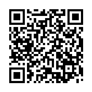 看到李毅站在办公室的绵州市大地图前二维码生成