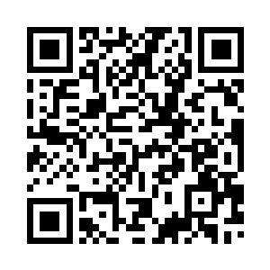 秦铮荣的妻子陈素梅就在床头坐着二维码生成