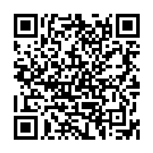 穆建林的身躯已经被一件黑色的铠甲包裹了起来二维码生成