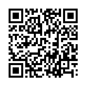 而是平端着手中的雷明顿狙击步枪站在大楼下二维码生成