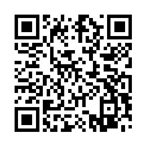 耿建国的老婆被吓的缩在了床头上的一角二维码生成