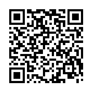 见到一辆黑色的车子停在美容院门口的停车场二维码生成