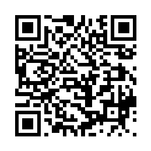 谭继之笑容可掬的坐在不远处的椅子里二维码生成