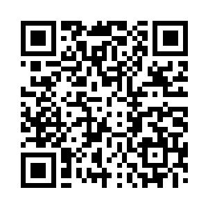 轿车在一栋名为华扬集团的大楼前停了下来二维码生成