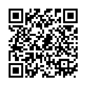 还放着一个插着没有点燃蜡烛的生日蛋糕二维码生成