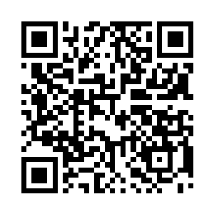 这个木头人的眉心深深的镶嵌进入了一枚铜钱二维码生成