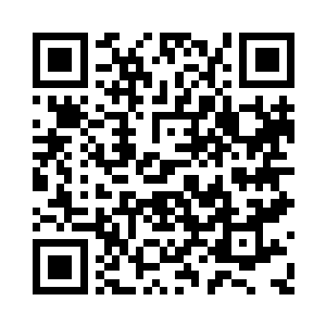 这位中年男子便是自行车车行的老板李诚信二维码生成