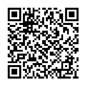 那几个闹事的人脑袋挂在了难民营外的十字架上二维码生成