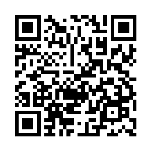 金诚置业集团福董事长张慧荣坐在车里二维码生成