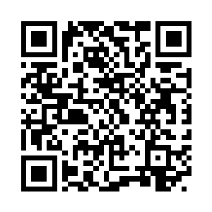 阿不都热依木站在一块铺满皑皑白雪的巨石山二维码生成